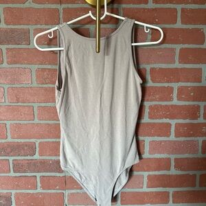 Elegant Beige Sleeveless Bodysuit